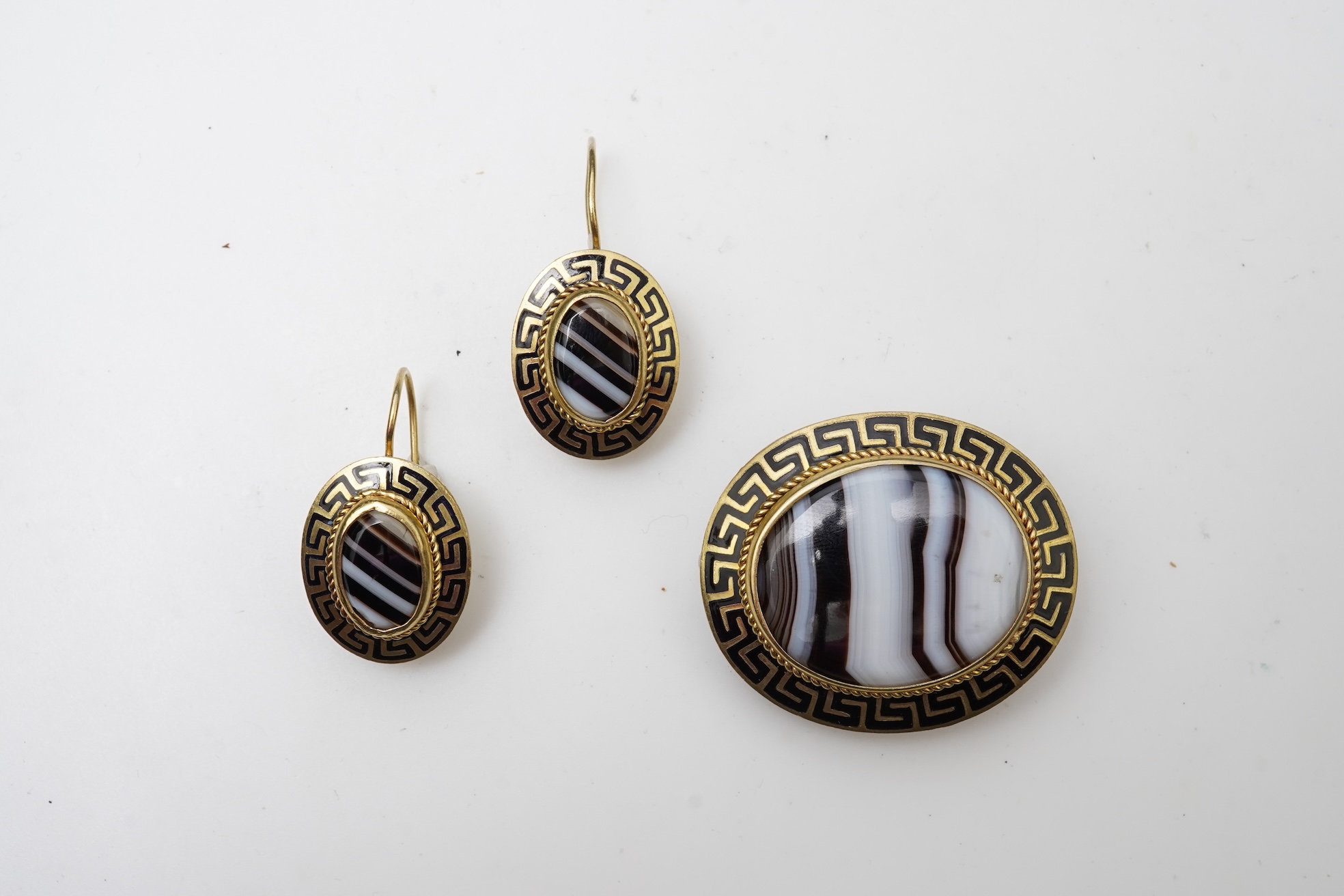 An enamel and onyx demi-parure, late 19th century